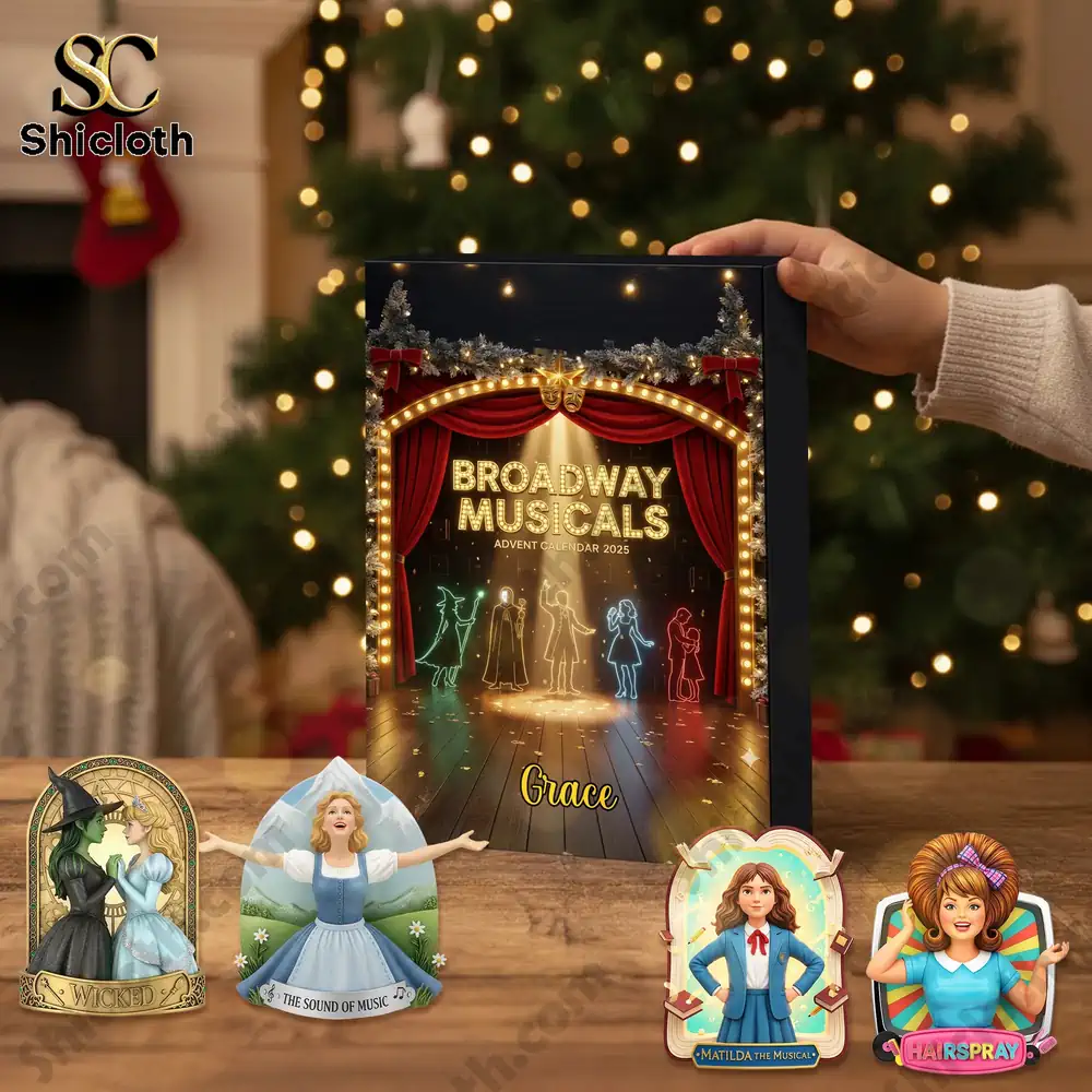 Personalized Gifts For Musical Lovers Christmas Advent Calendar Blind 6 Assorted Broadway musical ornaments displayed in front of a Christmas tree with the advent box beside them.