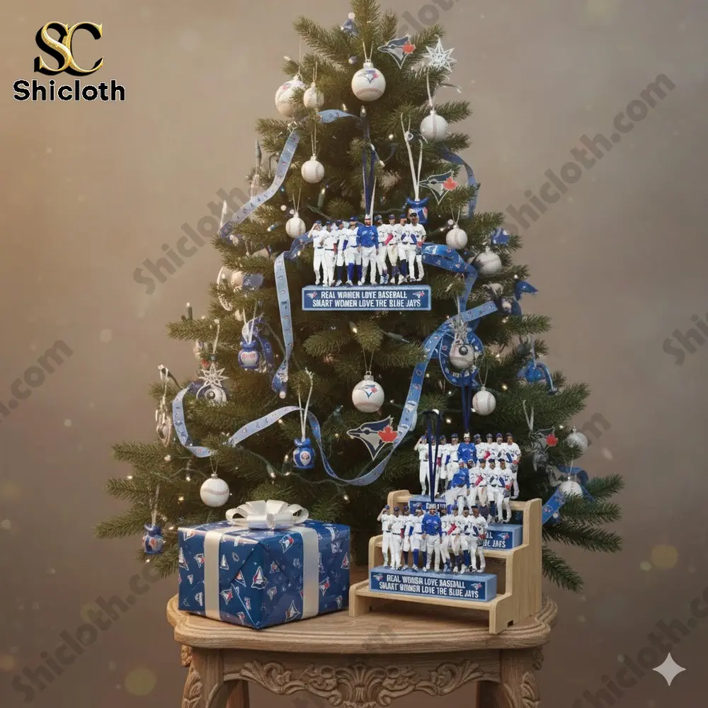 Christmas tree with Blue Jays themed ornaments and a figurine display.