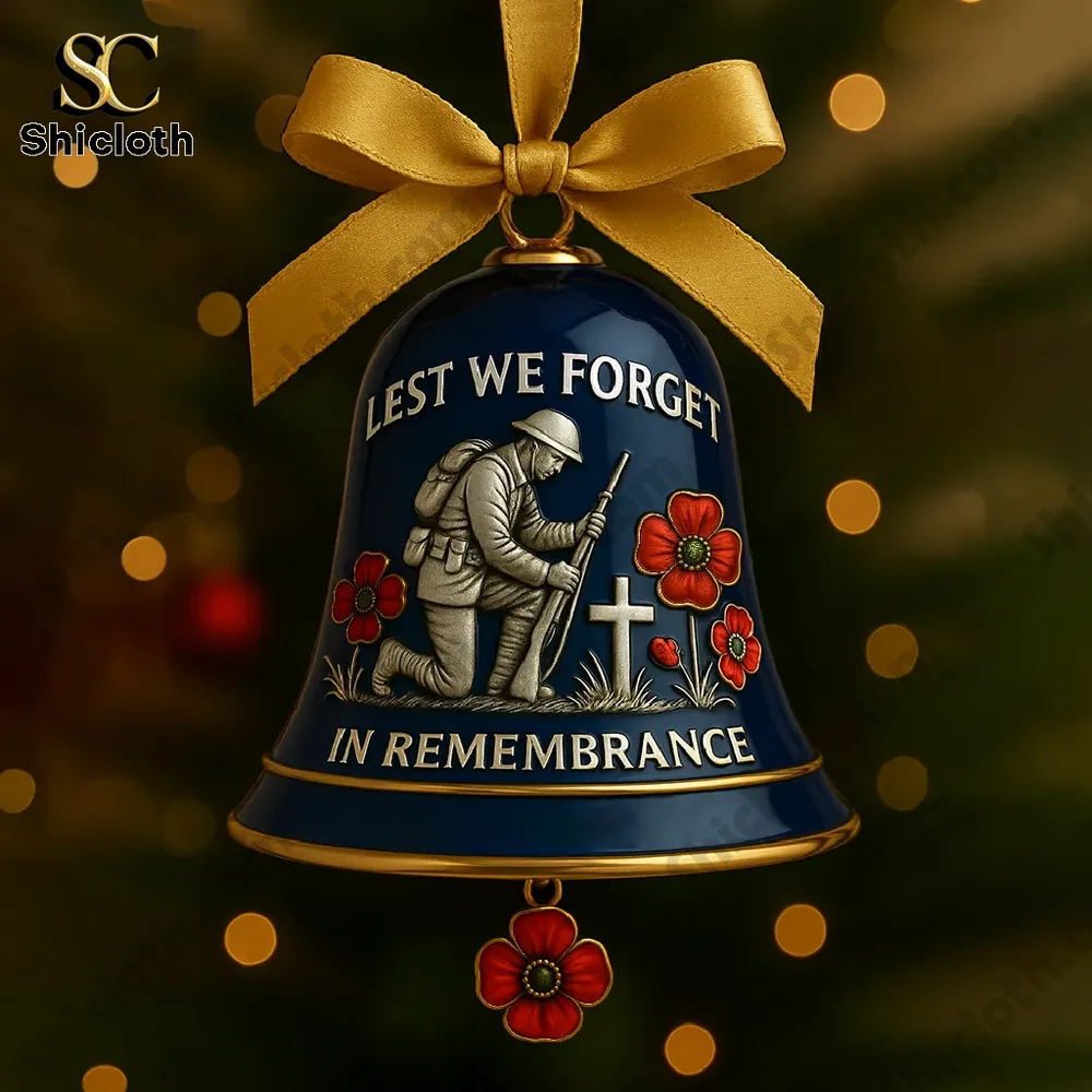 Close-up of "Lest We Forget" remembrance bell ornament featuring a soldier and poppies.