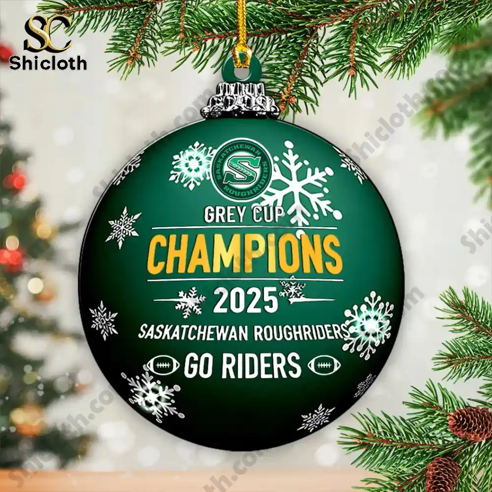 Green champions ornament hanging from a pine branch.