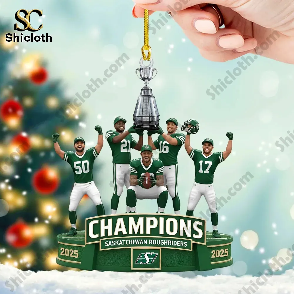 Hand holding a Saskatchewan Roughriders champions ornament with players lifting a trophy.