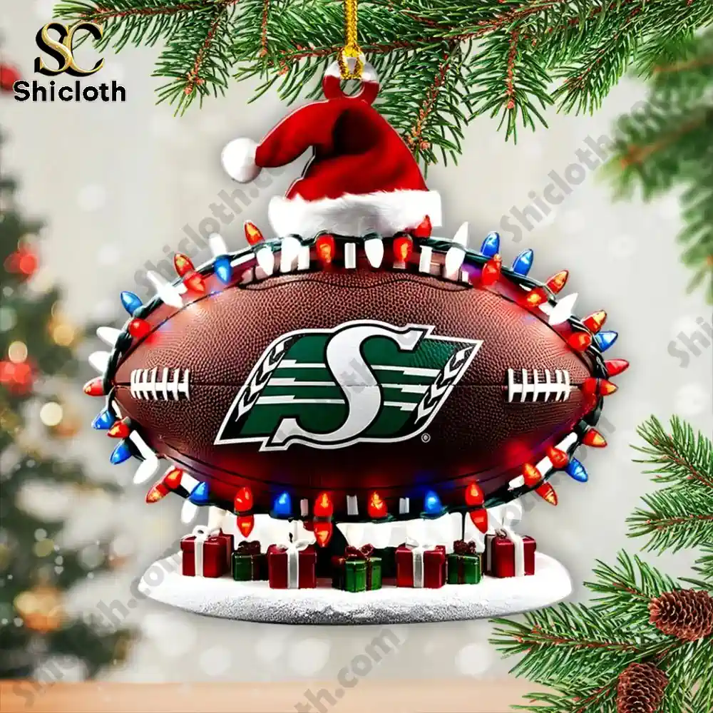 Football ornament with Saskatchewan Roughriders logo hanging on a Christmas branch.