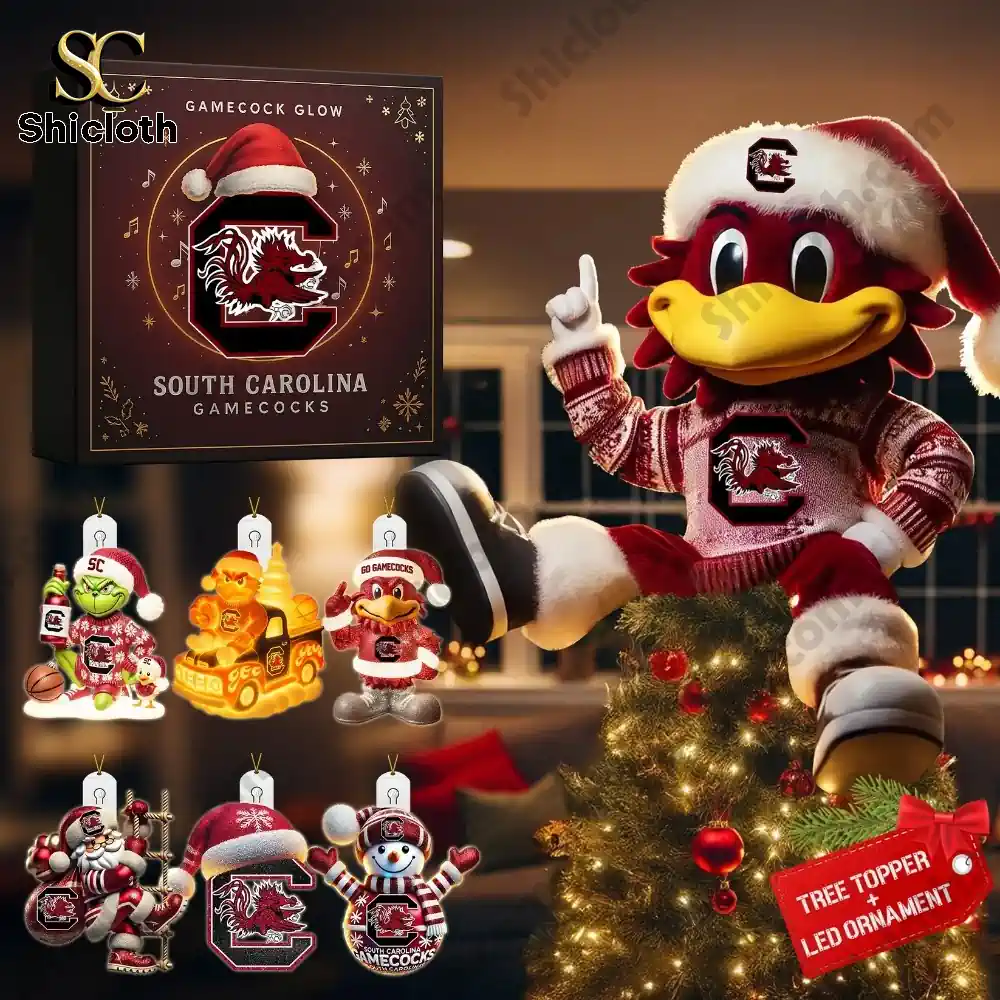 Assorted SC themed holiday ornaments arranged around a lit Christmas display.