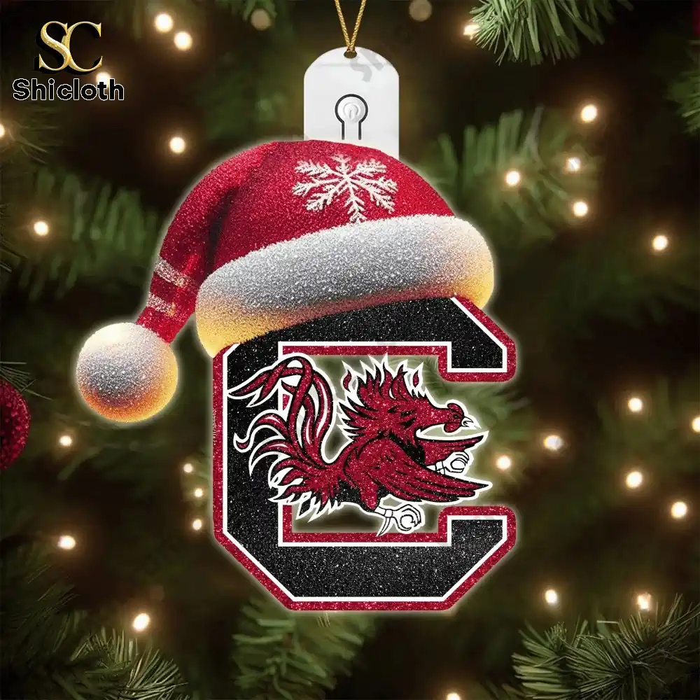 South Carolina Gamecocks Christmas Tree Topper And Ornament Set Gift Set 2025 4 Colorful SC inspired Christmas ornaments on a decorative stand.