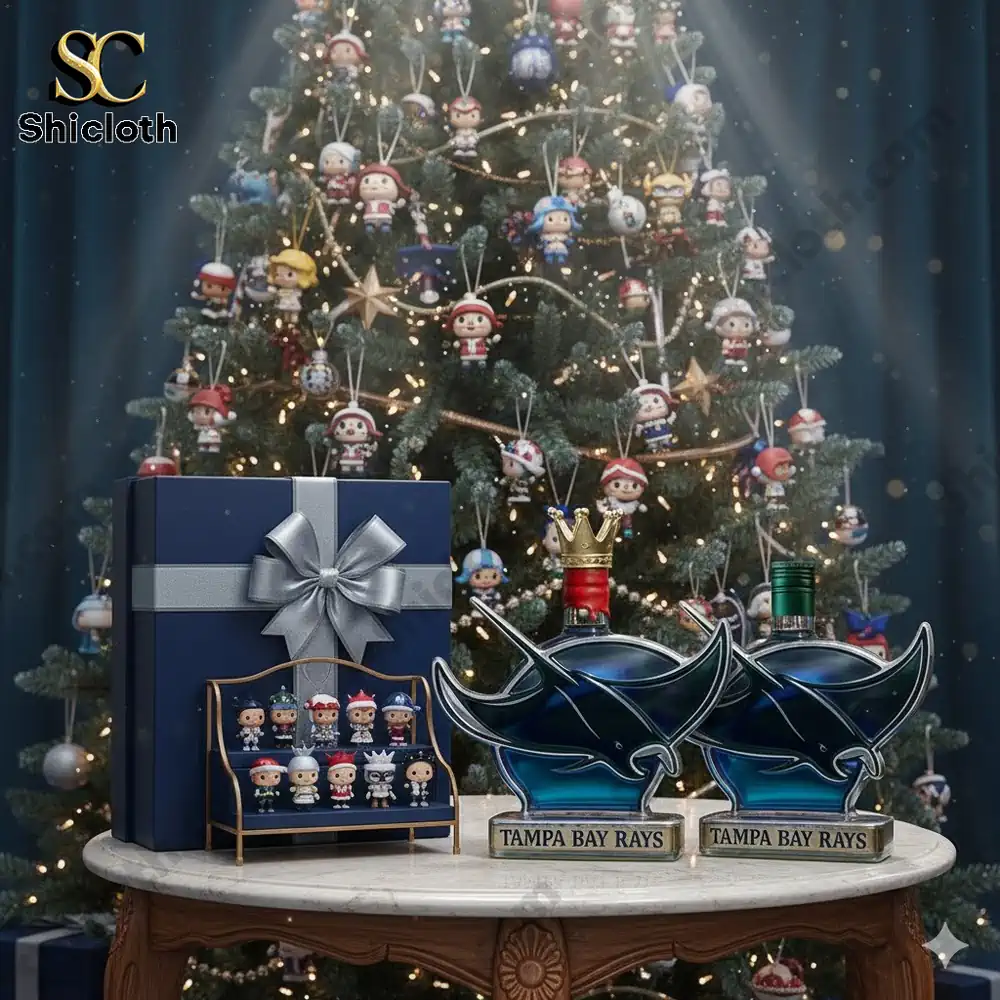 Christmas scene with Tampa Bay Rays themed bottles and small collectible figures displayed in front of a decorated tree.
