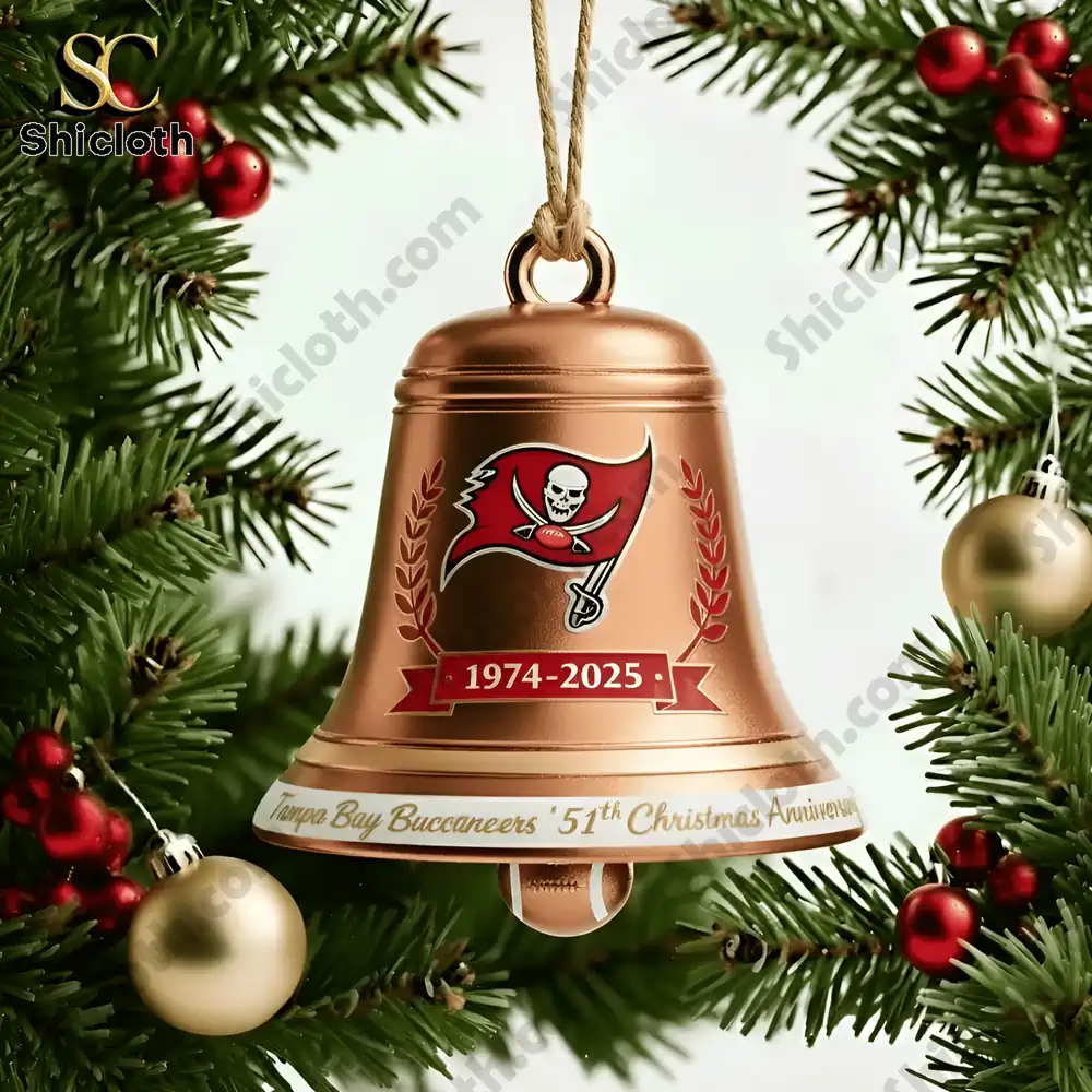Close-up of Tampa Bay Buccaneers 51st Anniversary bronze Christmas bell ornament hanging on a tree branch.