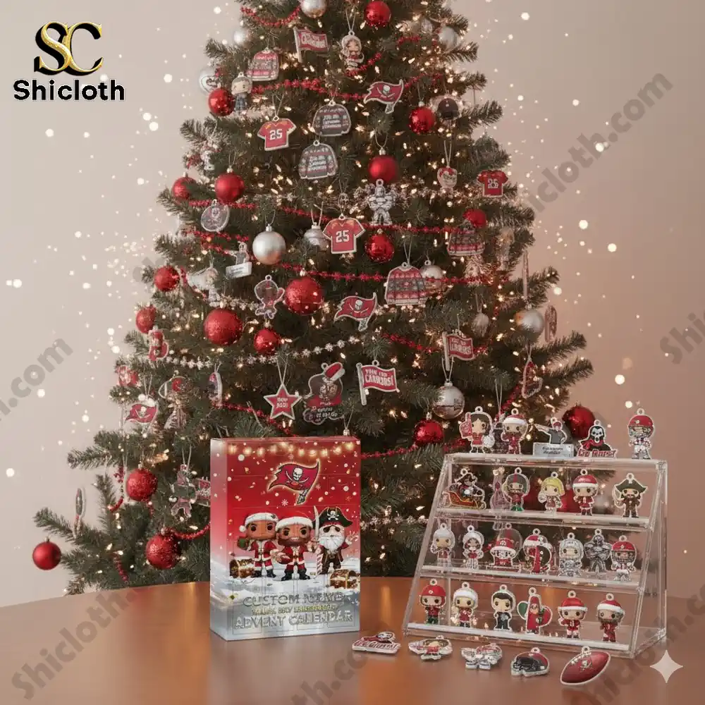 A decorated Christmas tree with red and silver ornaments and a Tampa Bay Buccaneers 2025 Advent Calendar displayed on a wooden table surrounded by small collectible figures!
