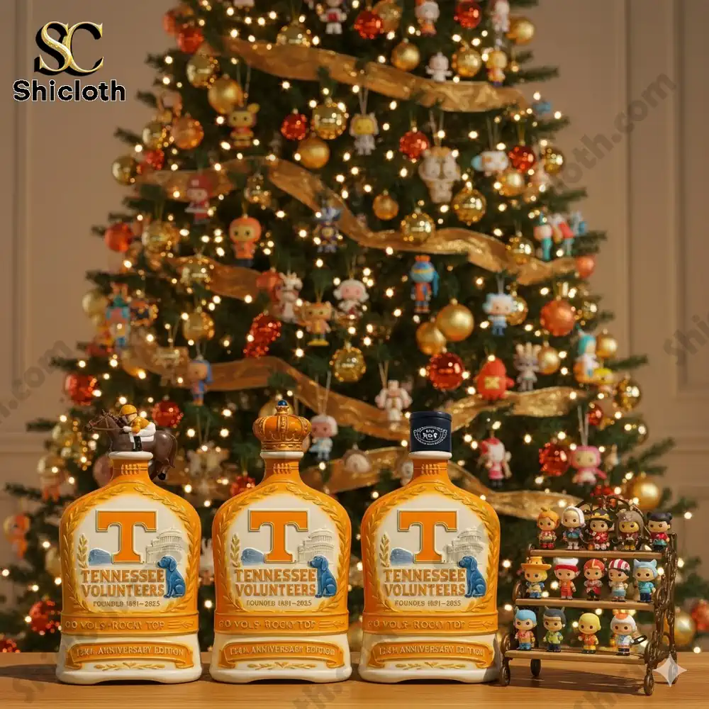 Holiday display with three Tennessee Volunteers bottles and small collectible figures in front of a decorated Christmas tree!