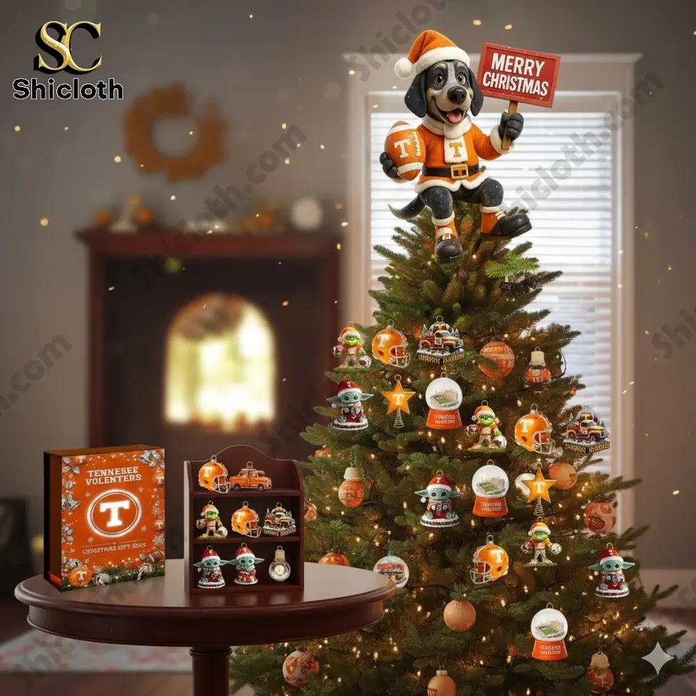 A Christmas tree decorated with Tennessee Volunteers themed ornaments topped with a dog figure holding a Merry Christmas sign.