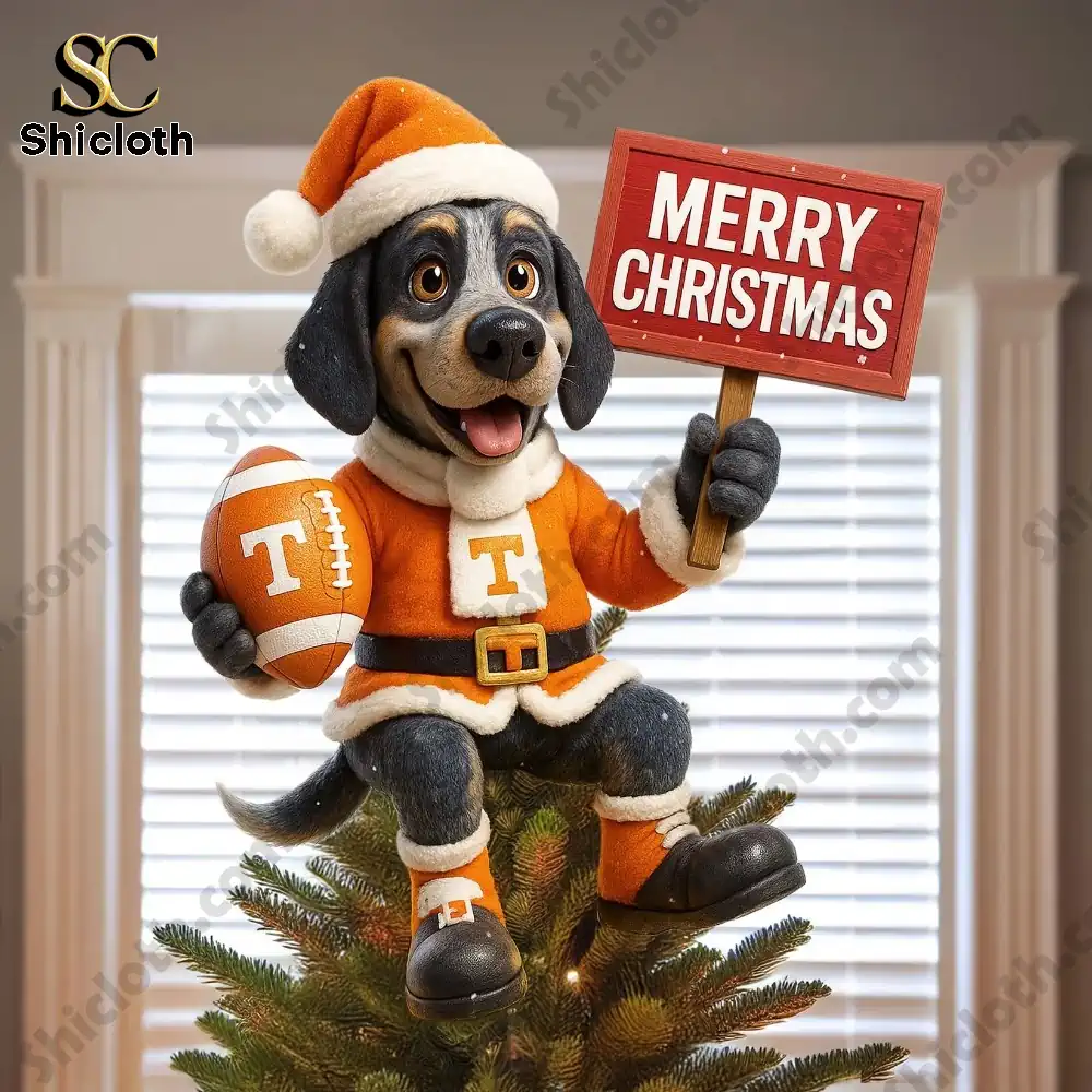 Tennessee Volunteers 2025 Christmas Tree Topper And Ornament Set 9 A dog mascot ornament in Tennessee Volunteers attire sitting atop a tree holding a Merry Christmas sign.