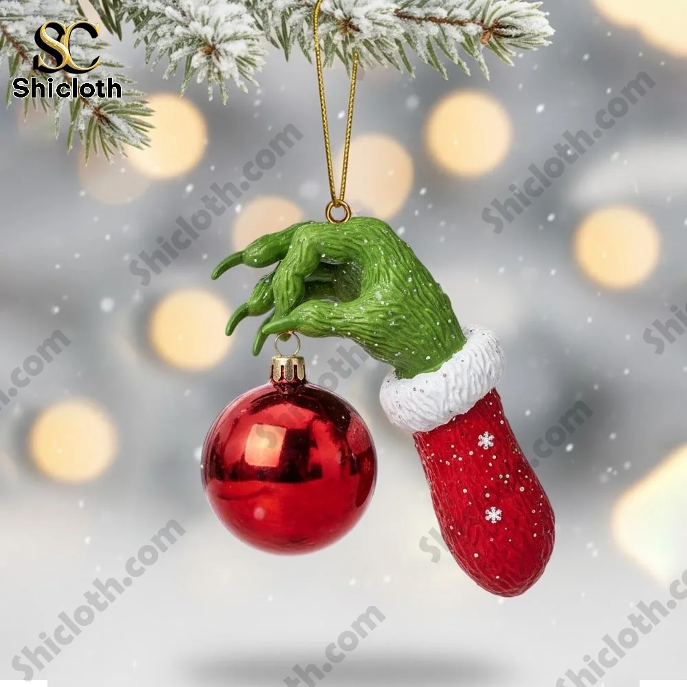 The Grinch Christmas 2025 Snowball Led Light And Ornament Set 7 Green hand ornament holding red Christmas bauble!