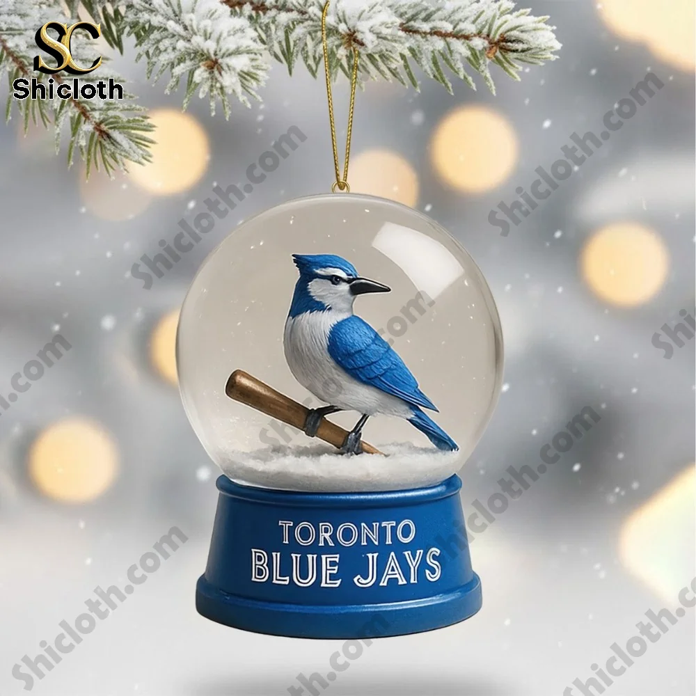 Blue bird figure inside a snow globe ornament hanging on a tree!