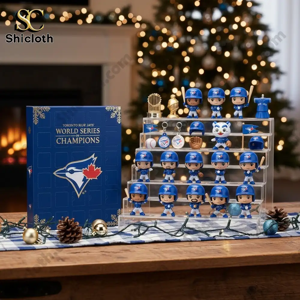The Toronto Blue Jays World Series Champions Advent Calendar 2025 box displayed with a collection of blue uniform mini figures and trophies.