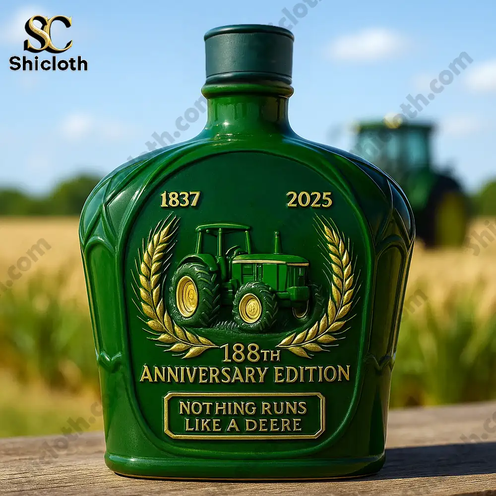 Close-up of John Deere 188th Anniversary Edition whiskey bottle with a tractor design and a year 1837-2025 inscription.