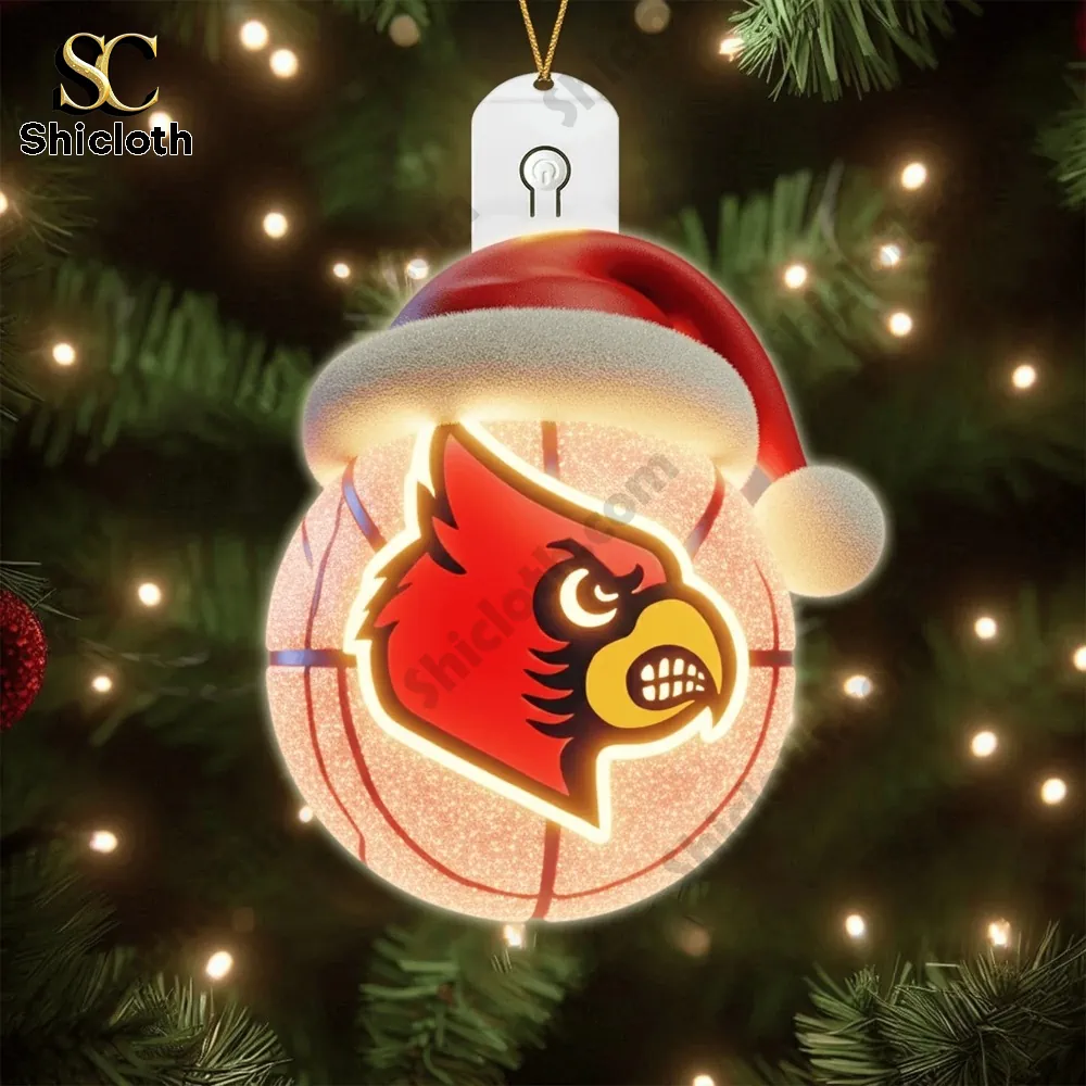 Louisville logo ornament hanging on a Christmas tree.