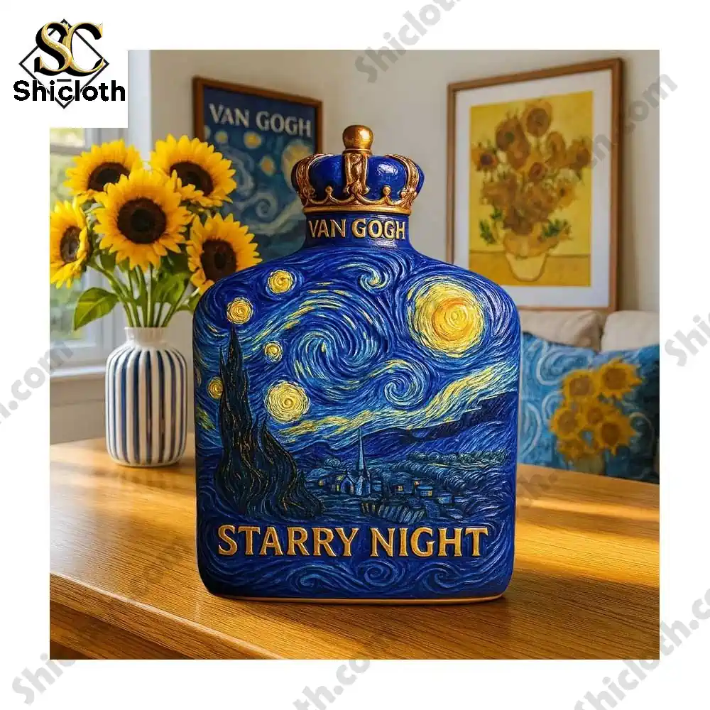 A close-up of a Starry Night whiskey bottle with a golden crown cap, placed on a wooden table with sunflowers and framed artwork in the background.