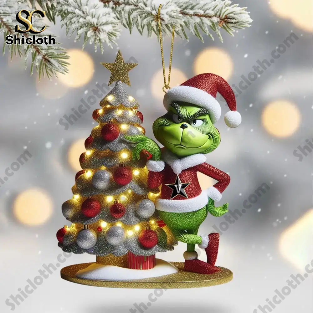 Vanderbilt Commodores Grinch 2025 Christmas Tree Topper And Ornament Set 5 Green character beside a decorated Christmas tree