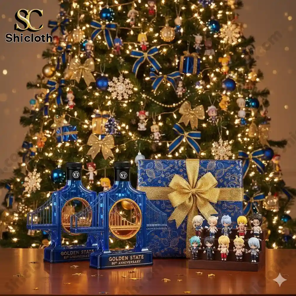 Golden State 80th Anniversary bottle with a gift box and figurines, surrounded by a Christmas tree adorned with blue and gold decorations.