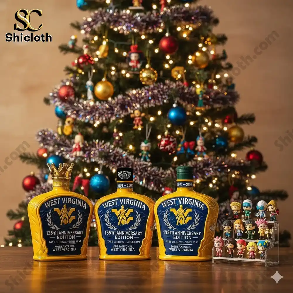 Three West Virginia anniversary bottles displayed in front of a decorated Christmas tree with small collectible figures.