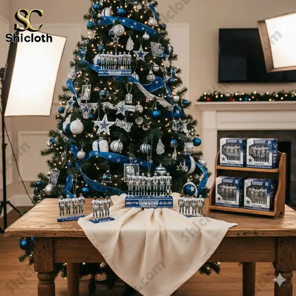 A collection of Dallas Cowboys figurines displayed on a table with a Christmas tree in the background.