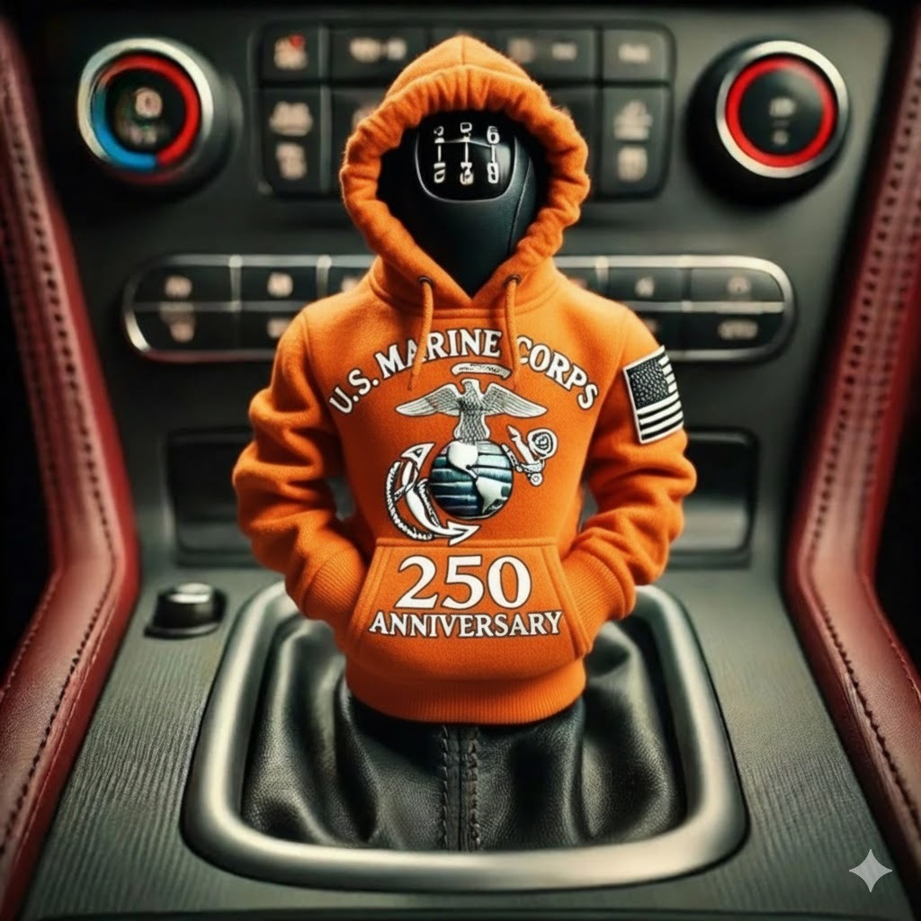 A U.S. Marine Corps 250th Anniversary hoodie in orange with a logo in the center.