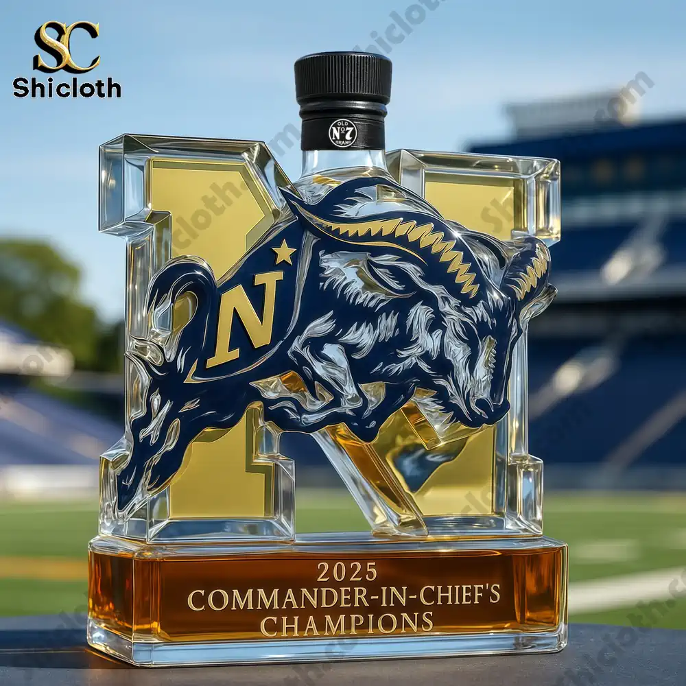 2025 Navy Commander-in-chief’s Champions Whiskey Bottle 5 A Navy trophy whiskey bottle with a standard black cap displayed outdoors in front of a football stadium.