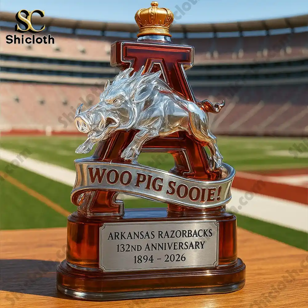 Arkansas Razorbacks 132nd Anniversary Woo Pig Sooie whiskey bottle with Razorback figure and crown.