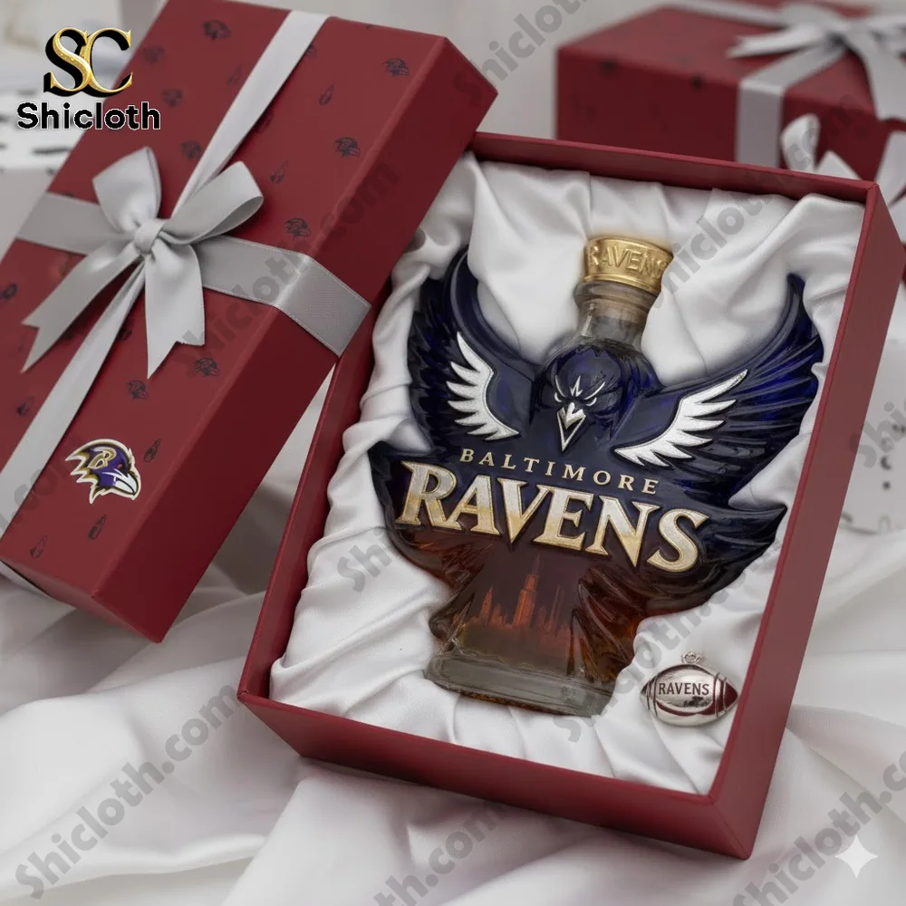 A close view of a Baltimore Ravens themed bottle inside a red gift box on white fabric!