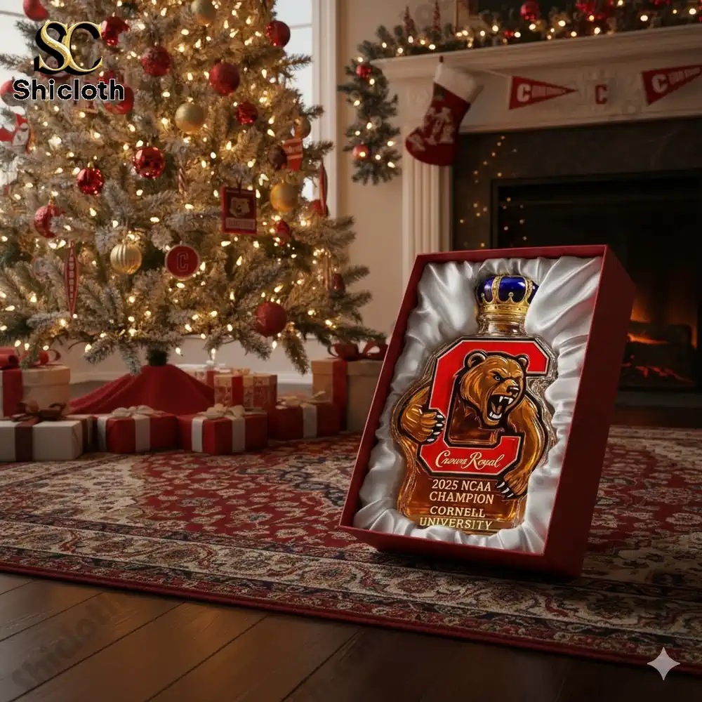 Gift box with Cornell bear themed whiskey bottle displayed by a Christmas tree!