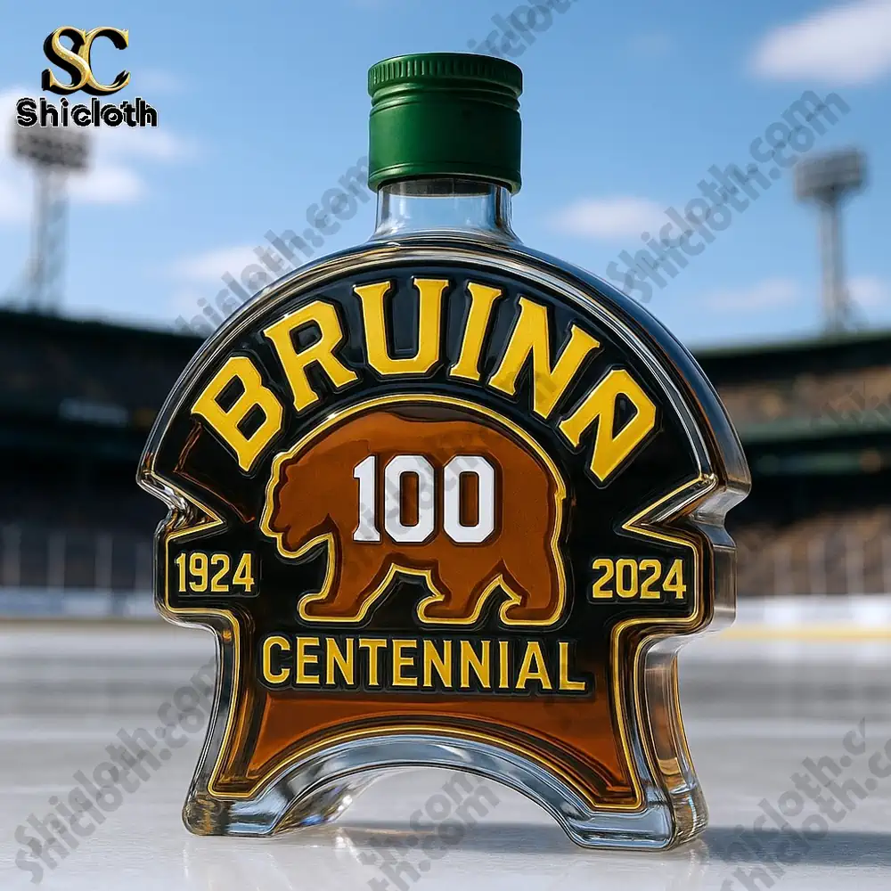 Bruins centennial bottle with green cap set on ice.