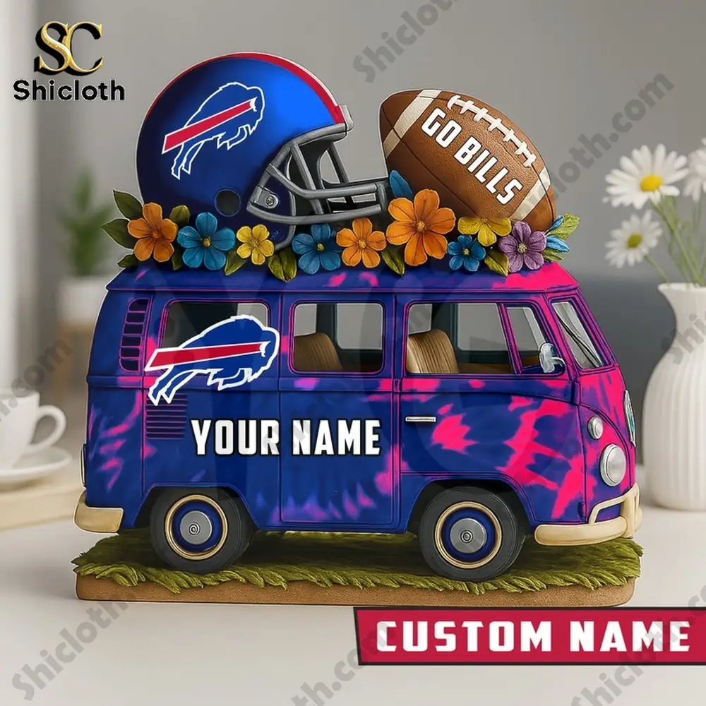 A decorative blue and pink van with a football helmet and ball on top.