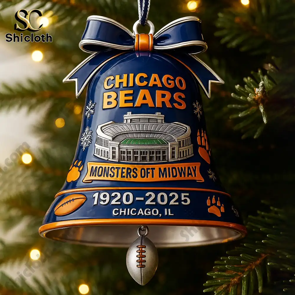 Close view of a Chicago Bears bell ornament hanging on a christmas tree.