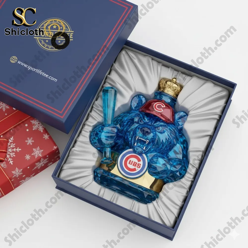 A blue crystal bear statue wearing a red cap is displayed inside a padded gift box.