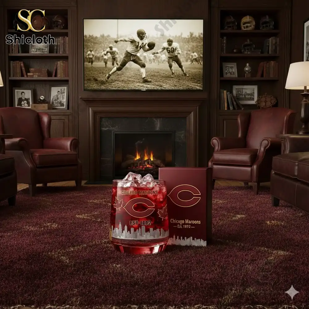 A cozy living room featuring a Chicago Maroons themed glass with a red drink and a vintage football photo on the wall.