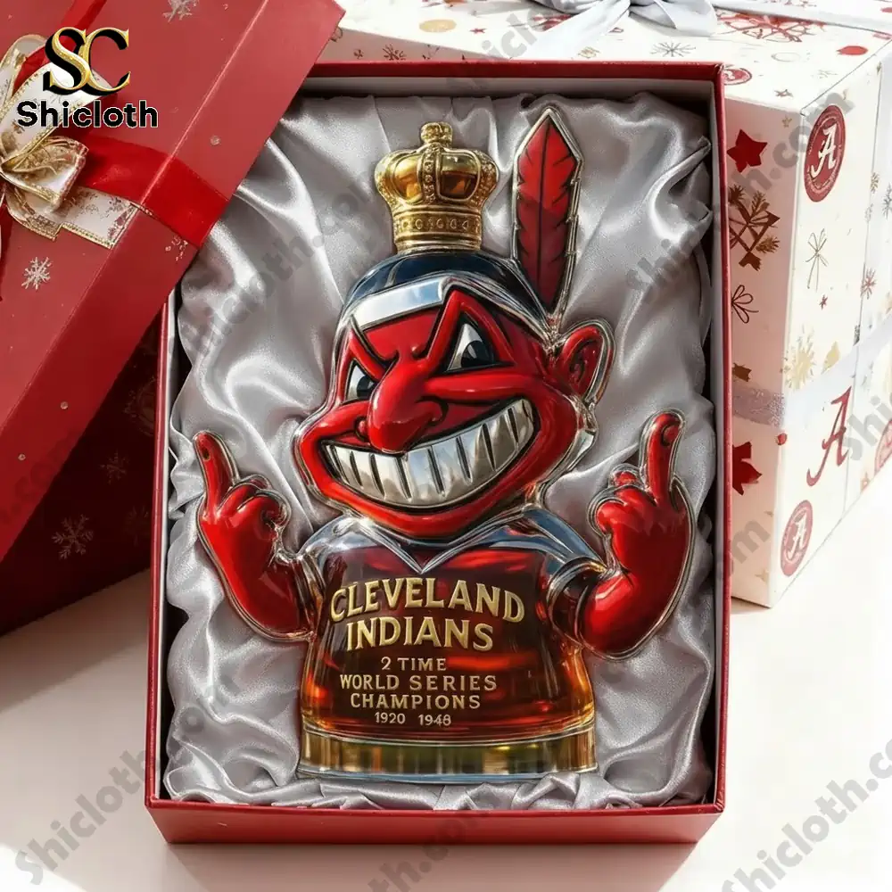 A mascot shaped bottle with a crown and feather presented in a satin lined gift box.