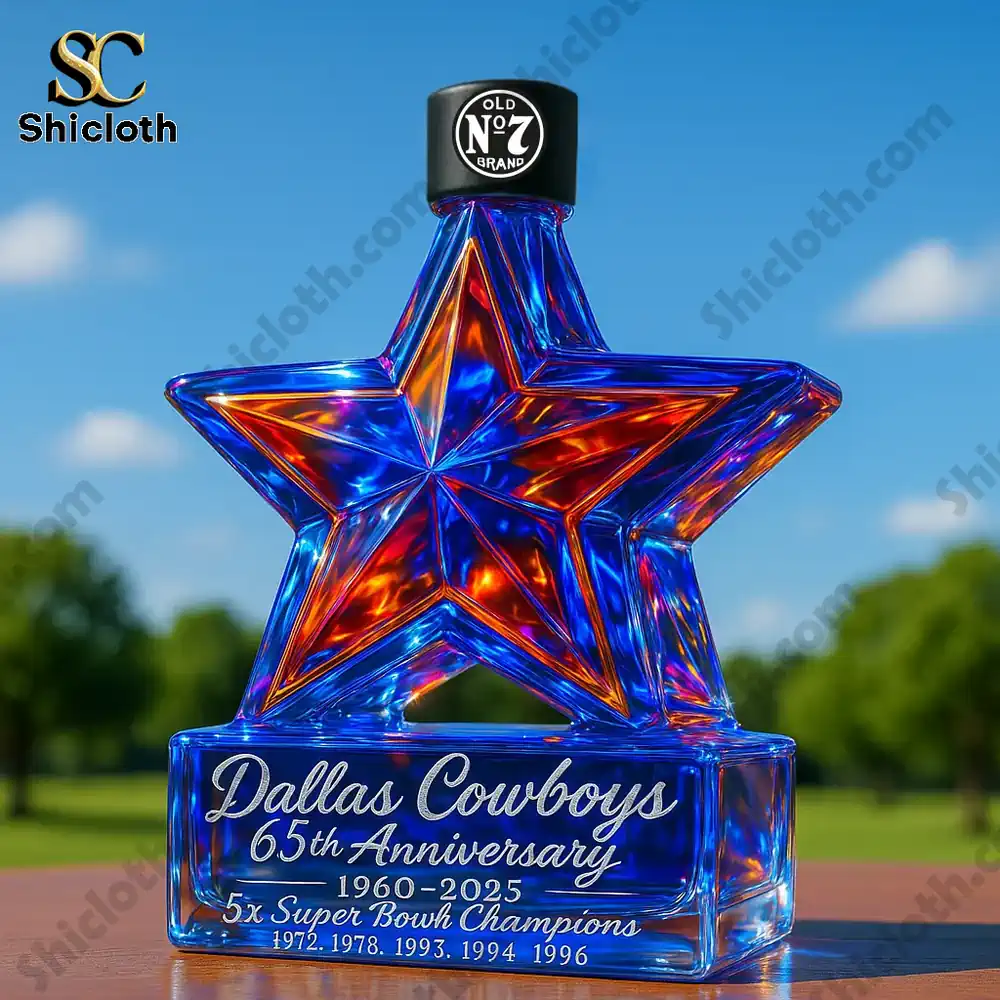 Dallas Cowboys star glass bottle with black cap outdoors.