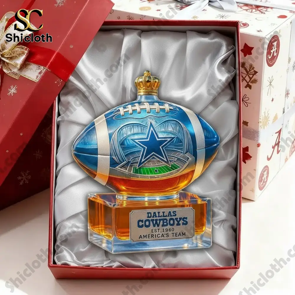 A Dallas Cowboys football collectible displayed inside a gift box.