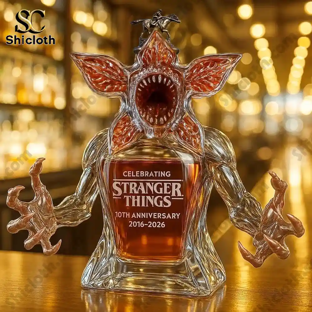 Demogorgon shaped glass bottle on a bar counter with warm lights in the background.