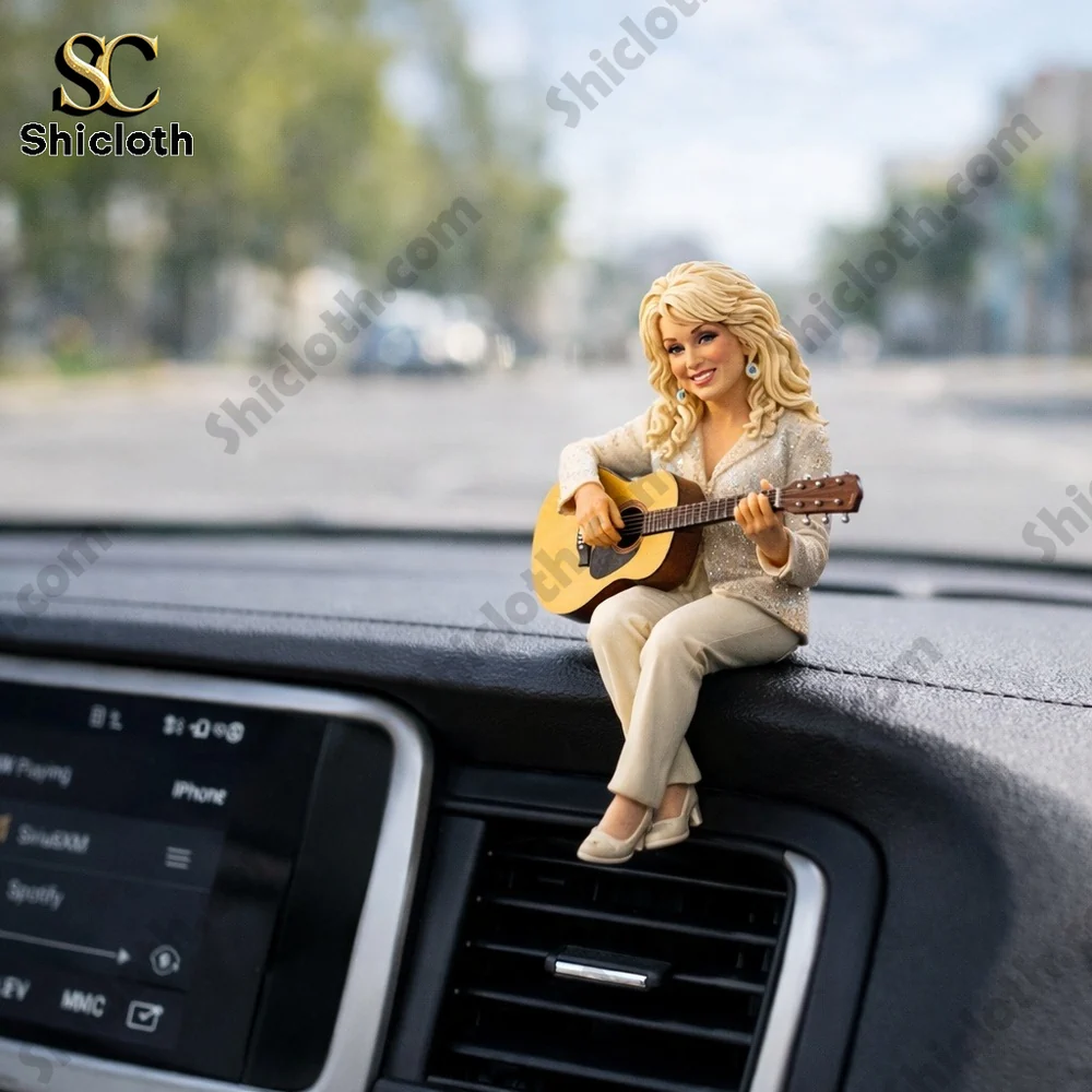 Dolly Parton inspired singer figurine playing guitar on dashboard!
