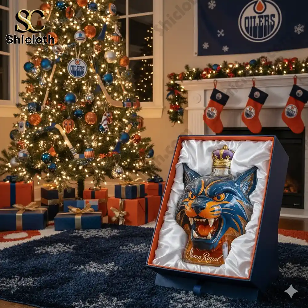 A gift box displaying a blue orange mascot head bottle in a Christmas decorated room with tree and stockings.