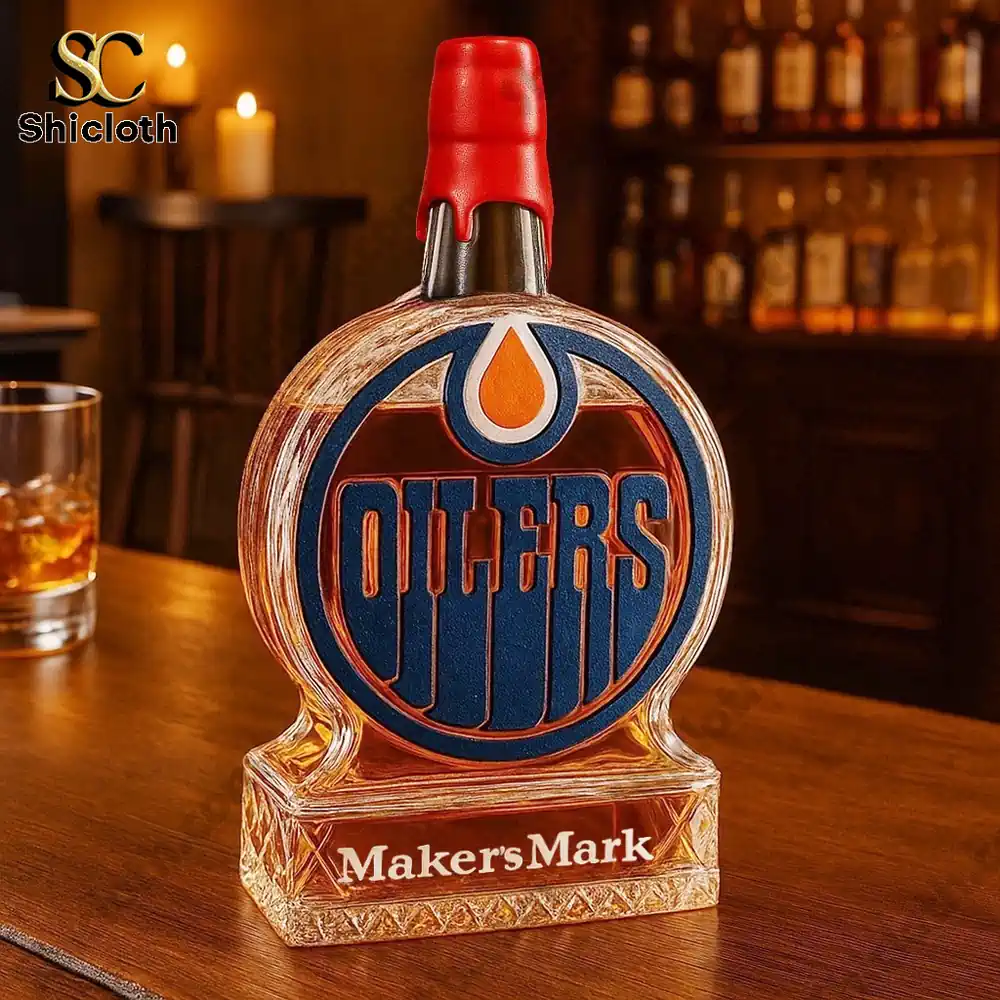 An Edmonton Oilers themed bottle styled after Makers Mark displayed on a bar counter.