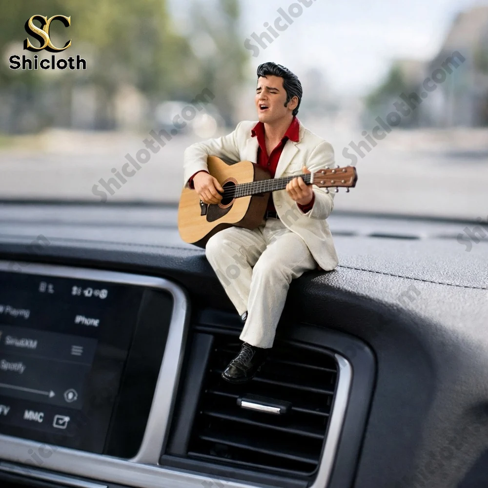 Elvis inspired rock singer figurine playing guitar on dashboard!