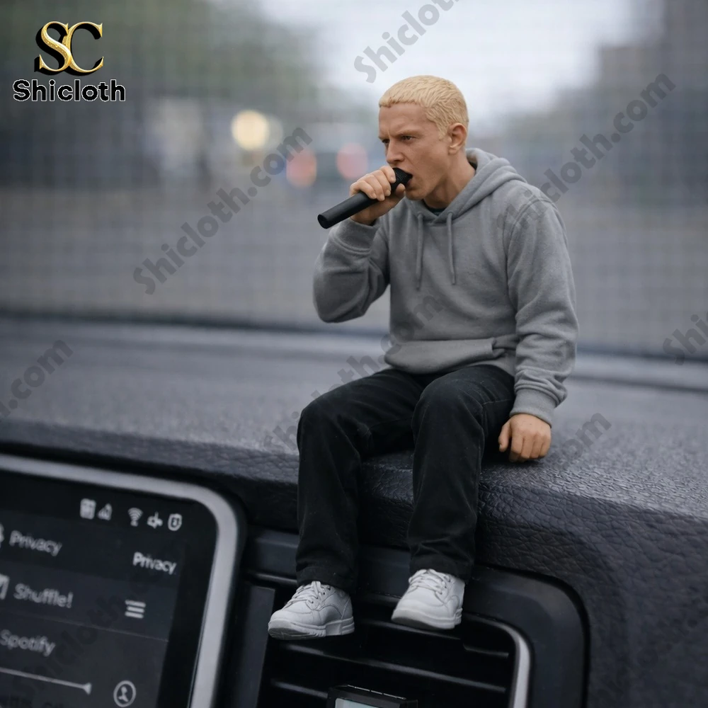 Small rapper figure sitting on a car dashboard holding a microphone!