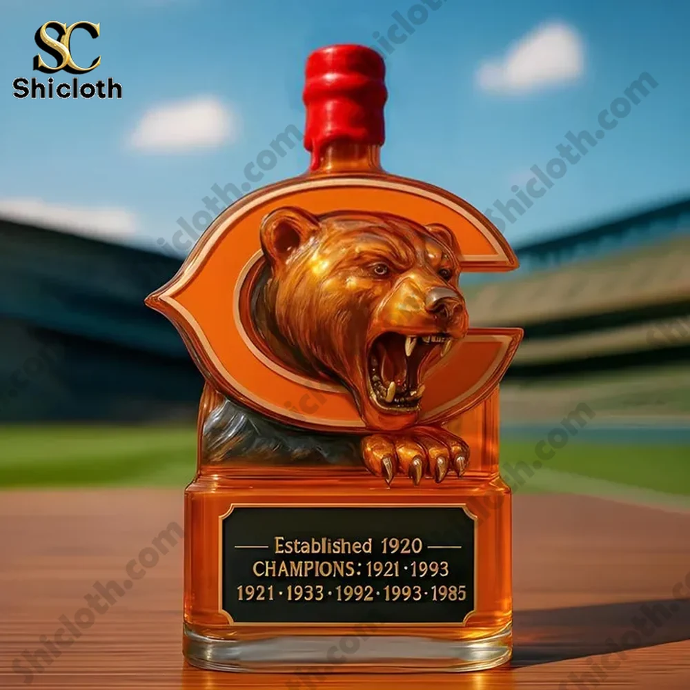 Chicago Bears NFL Champs Christmas Gift Whiskey Bottle 3 Bear crest bottle with red top on a table in front of a stadium from Shicloth