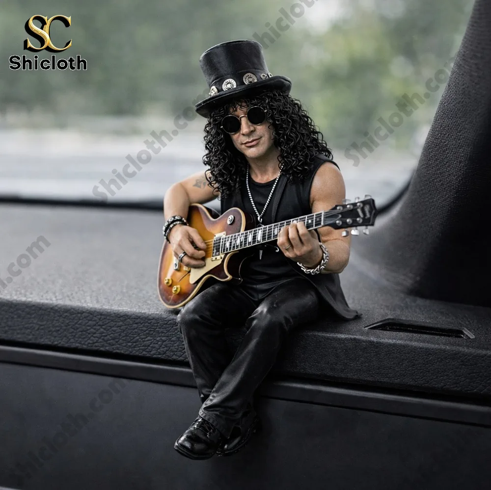 Rock guitarist figurine playing electric guitar on car dashboard!