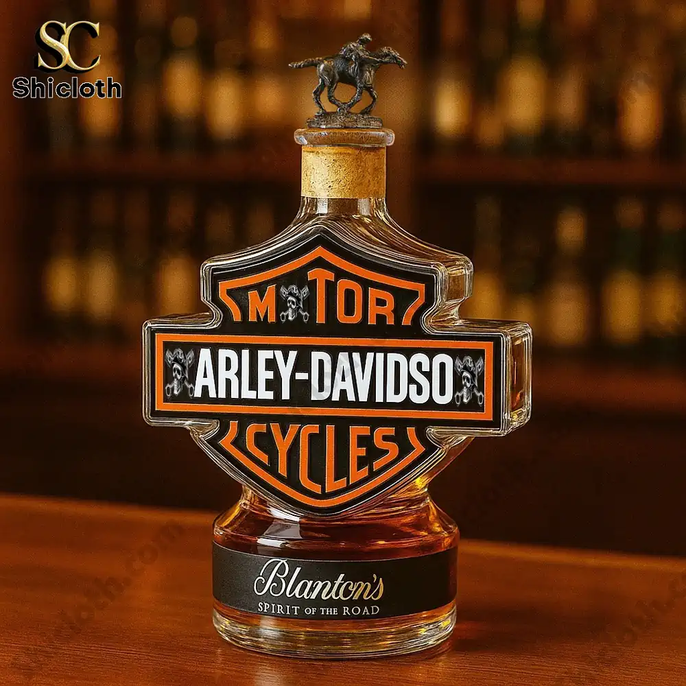 A whiskey bottle shaped like the Harley Davidson logo featuring Blantons branding on a bar counter!