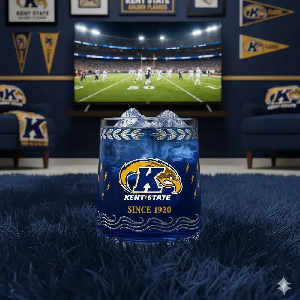 A Kent State themed glass with blue drink and ice in a football viewing room.