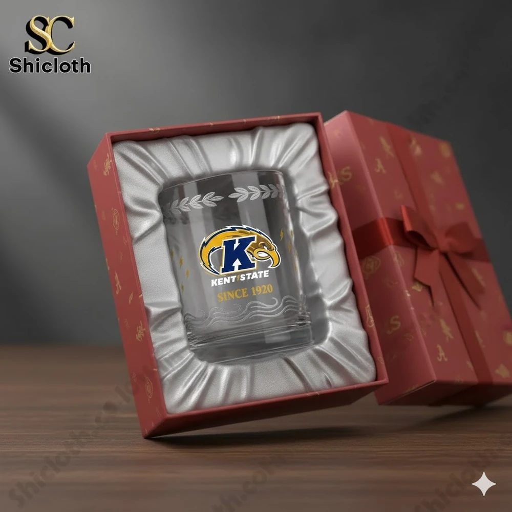A Kent State glass displayed in a red gift box with satin padding.