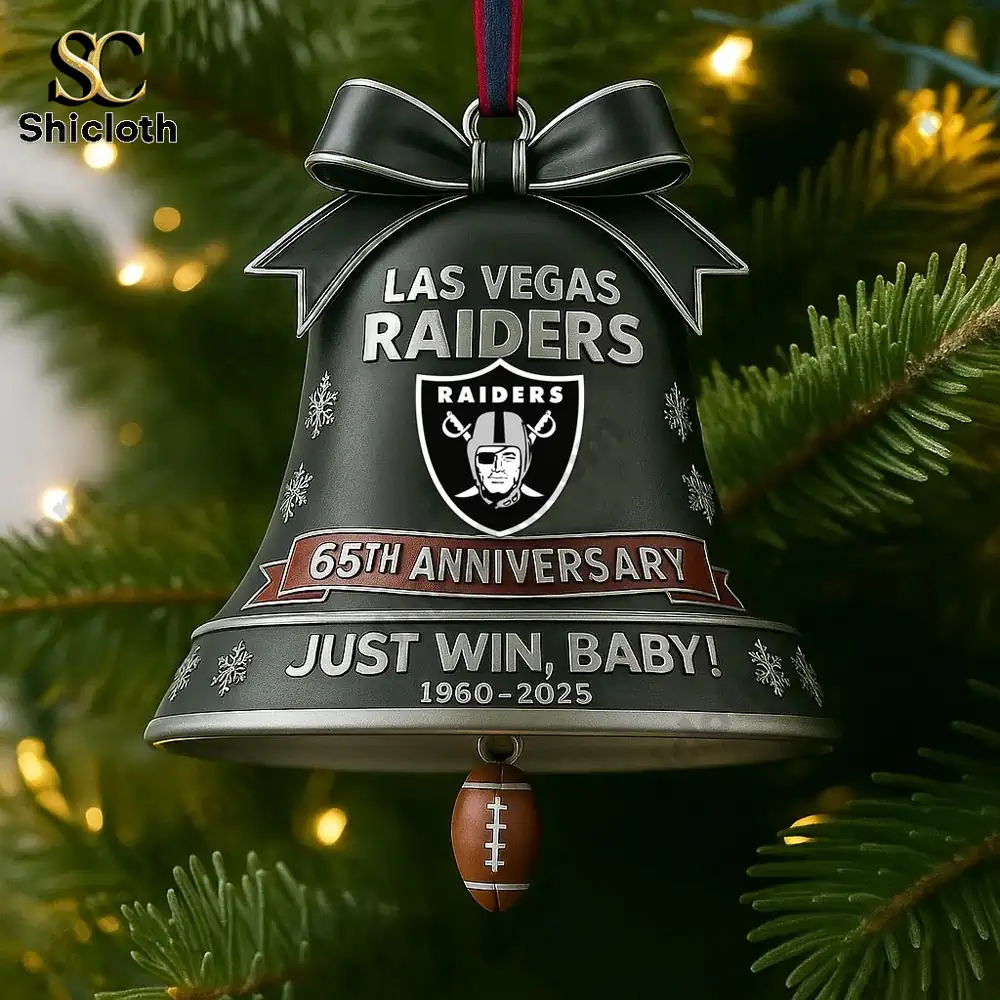 Close view of a Raiders sixty fifth anniversary bell ornament from Shicloth hanging on a Christmas tree.