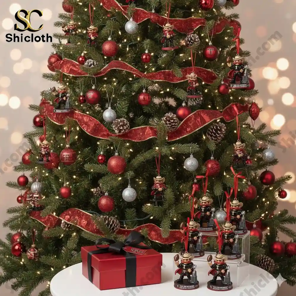 Christmas tree decorated with red and silver ornaments and cowboy mascot ornaments.